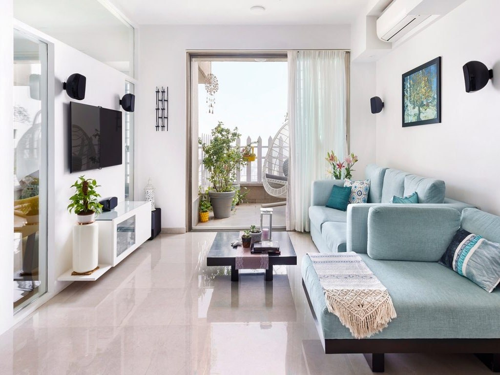 interior design ideas for 2 bhk flat - A white palette and minimal interiors maximise space in this